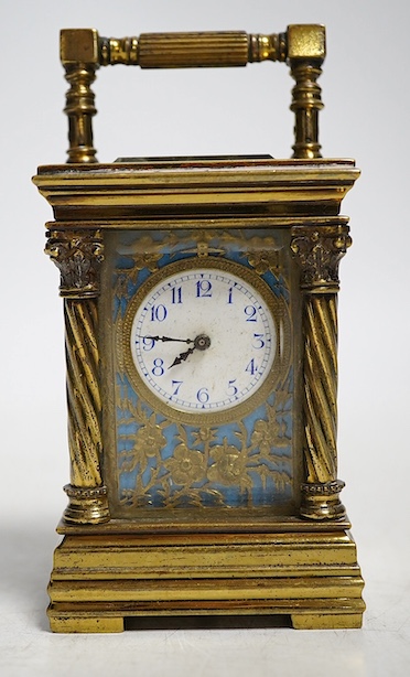 A miniature carriage timepiece, with four ornate corner columns, turquoise dial and gilt filigree mount, 8cm high. Condition - fair, not tested as working